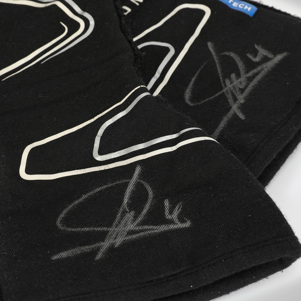 Black Lando Norris 2023 F1 Race gloves with white outlines and signatures on a white background