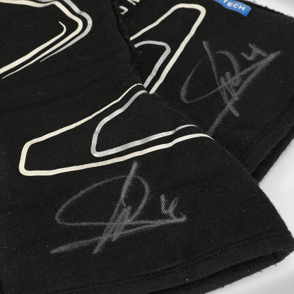 Black Lando Norris 2023 F1 Race gloves with white outlines and signatures on a white background