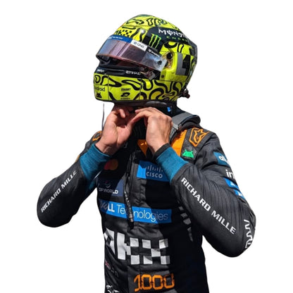 Lando Norris wearing a McLaren Monaco GP racing suit with various sponsor logos with Close View