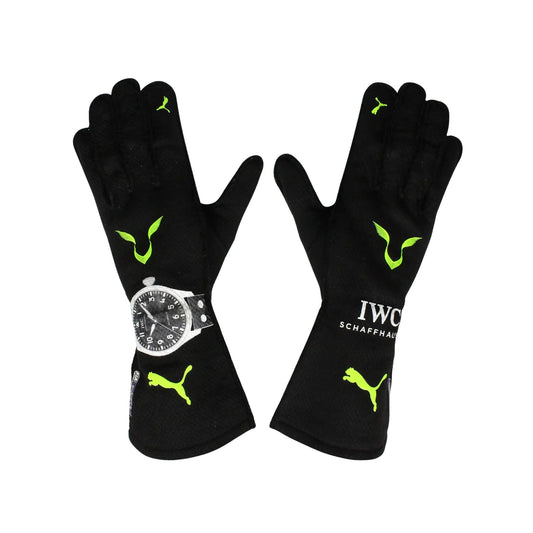 Black Lewis Hamilton 2022 F1 Race gloves with green accents and a watch on a white background