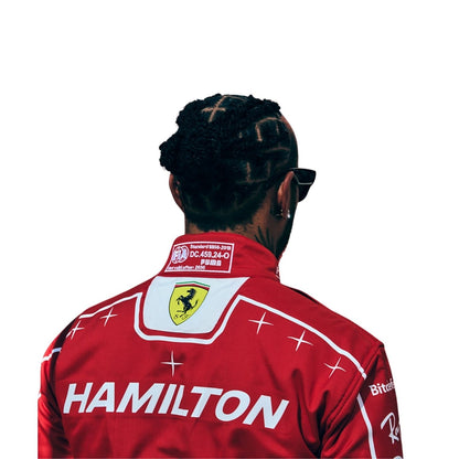 Rear view of a person wearing a red Ferrari team Suit with 'HAMILTON' printed across the back, a Ferrari shield logo on the neck, and sponsor logos, against a plain white background.