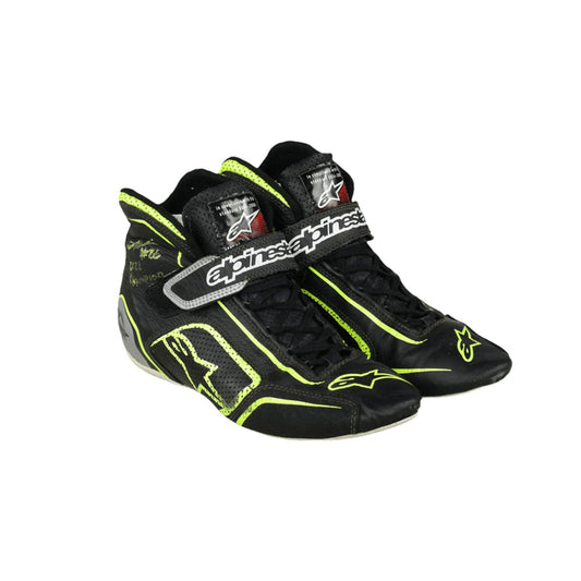 Black and yellow Linus Lundqvist Championship HMD 2022 Indy Lights race shoes with visible branding on a white background