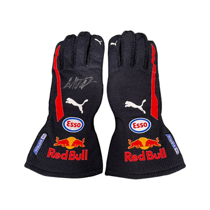 Pair of black Max Verstappen 2018 F1 race gloves with Red Bull and Esso branding on a white background