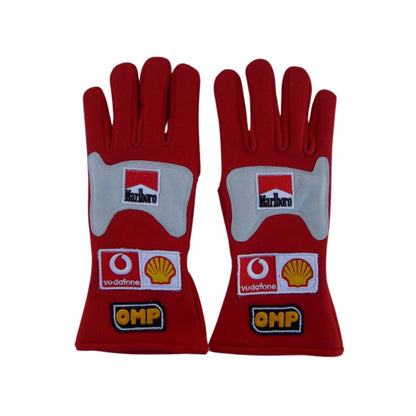 Red Michael Schumacher 2006 F1 Race gloves with multiple brand logos on a white background