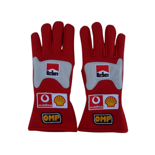 Red Michael Schumacher 2006 F1 Race gloves with multiple brand logos on a white background