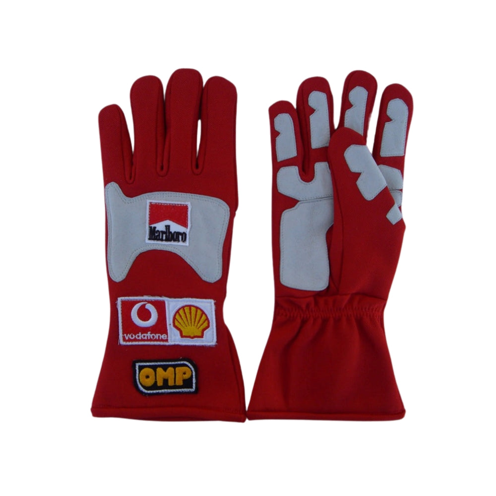 Red Michael Schumacher 2006 F1 Race gloves with sponsor logos on a white background