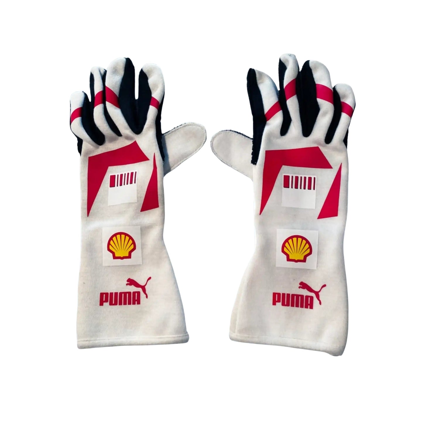 Pair of white Michael Schumacher 2007 F1 race gloves with red and black accents featuring Puma and Shell logos on a white background.