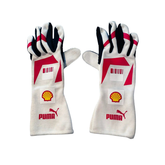 Pair of white Michael Schumacher 2007 F1 race gloves with red and black accents featuring Puma and Shell logos on a white background.