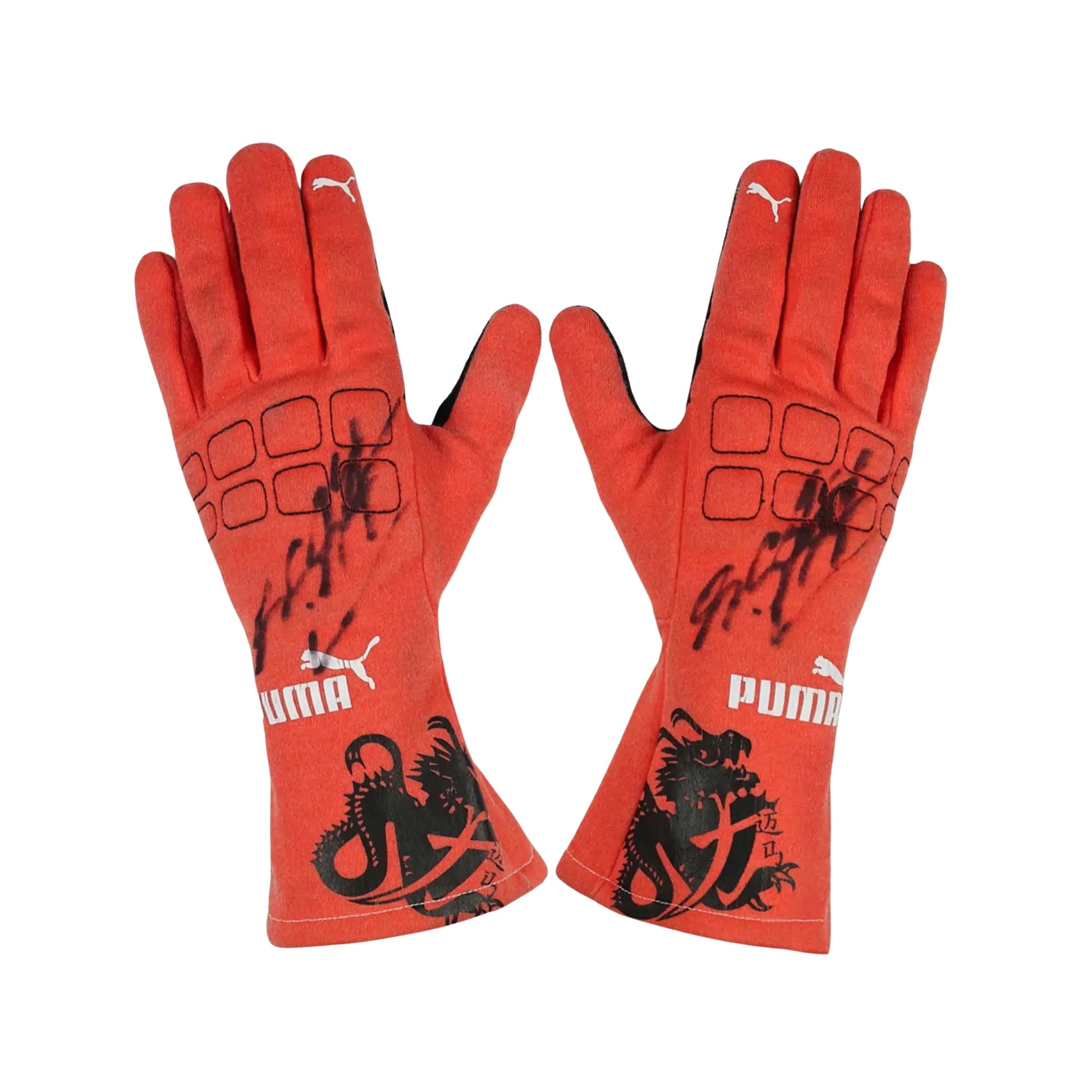 Red Michael Schumacher 2012 F1 Race gloves with black designs and Puma logo on a white background