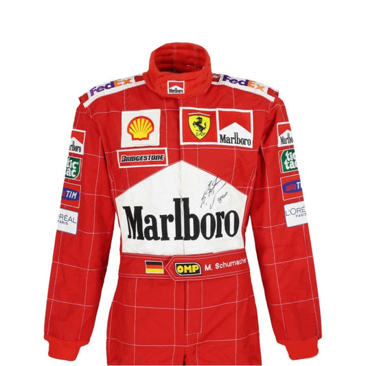 Close-up of Schumacher’s 2004 F1 suit, showing high-quality red fabric, tight white stitching, and finely printed sponsor details true to the original.