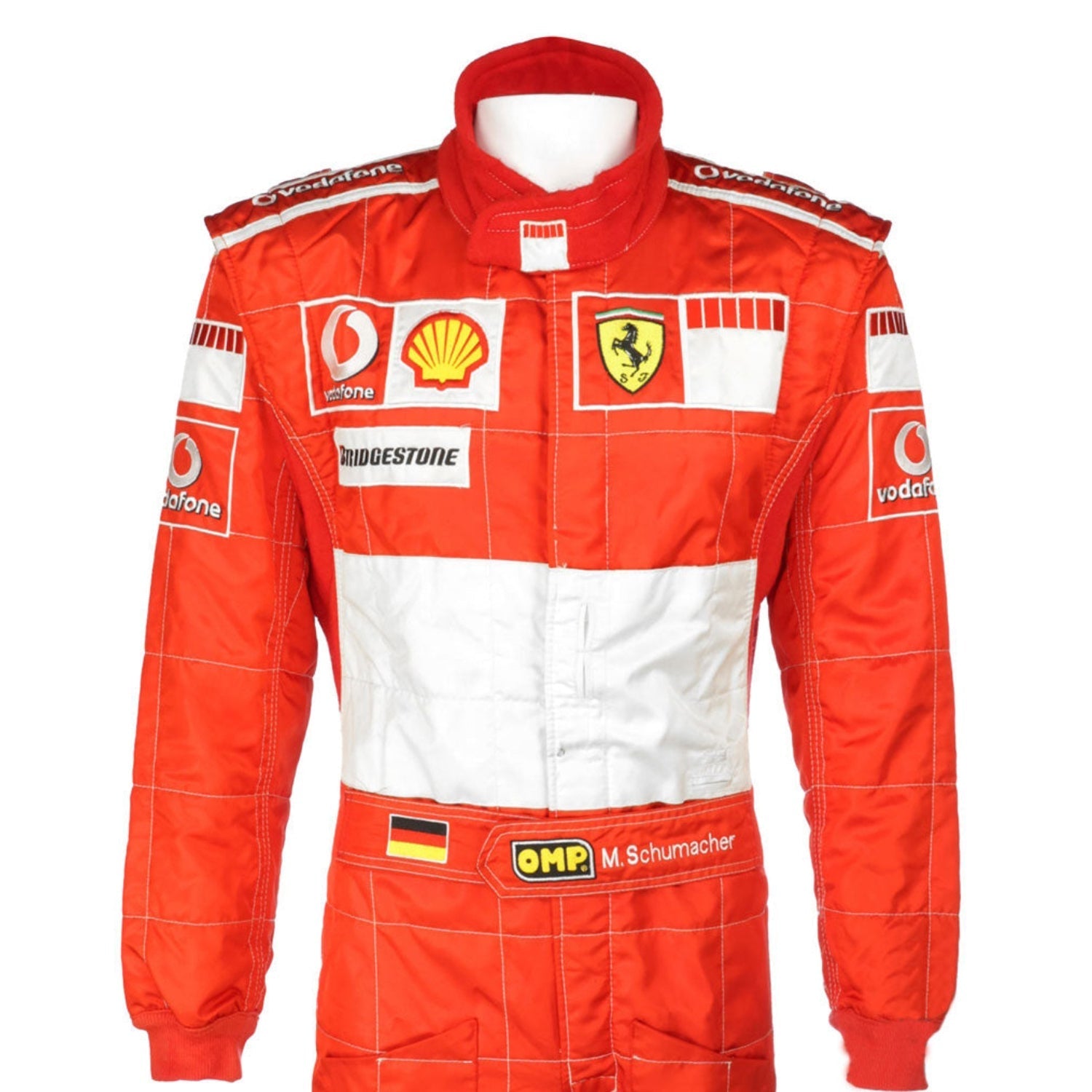Michael Schumacher wearing a Red and white Ferrari F1 racing suit in 2006 with various sponsor logos on a white background