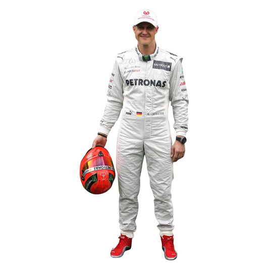 Front view of the 2012 Michael Schumacher F1 racing suit, featuring a silver base with black and green accents, and stitched sponsor panels across the chest.