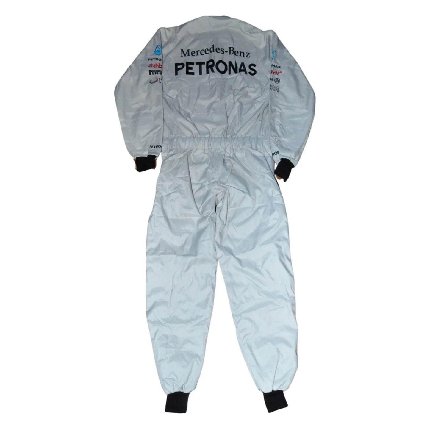 Back view of Schumacher’s 2012 F1 suit showing full-length silver material with contrasting black paneling and his signature logo on the upper back.