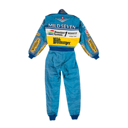 Backside of Schumacher’s 1995 racing suit, showcasing a green-dominated rear panel with blue sleeves and prominent yellow sponsor branding.