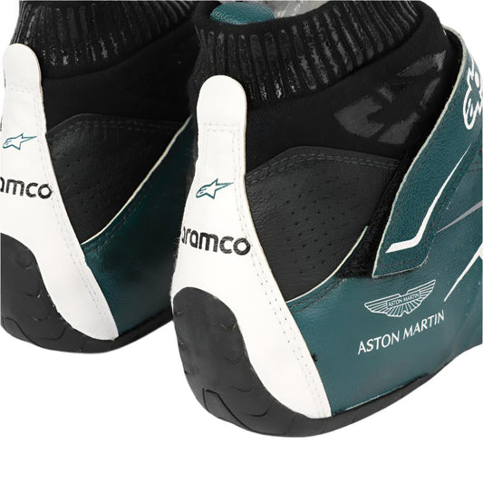Pair of green and black Nico Hülkenberg 2022 F1 race shoes with 'Aston Martin' branding on a white background
