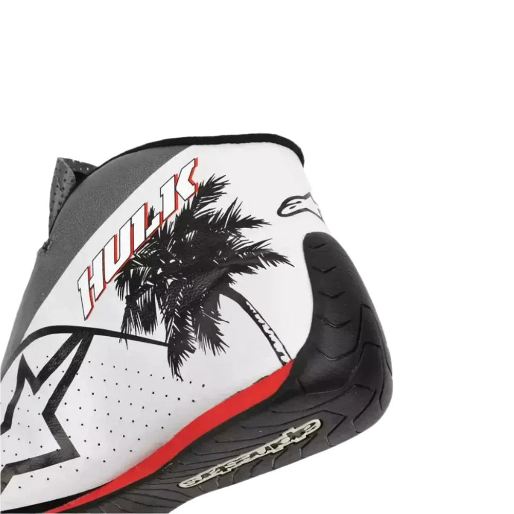 Close-up of a Nico Hülkenberg 2023 Miami GP Weekend Worn F1 Racing Shoes with palm tree design and 'Huk' branding on a white background