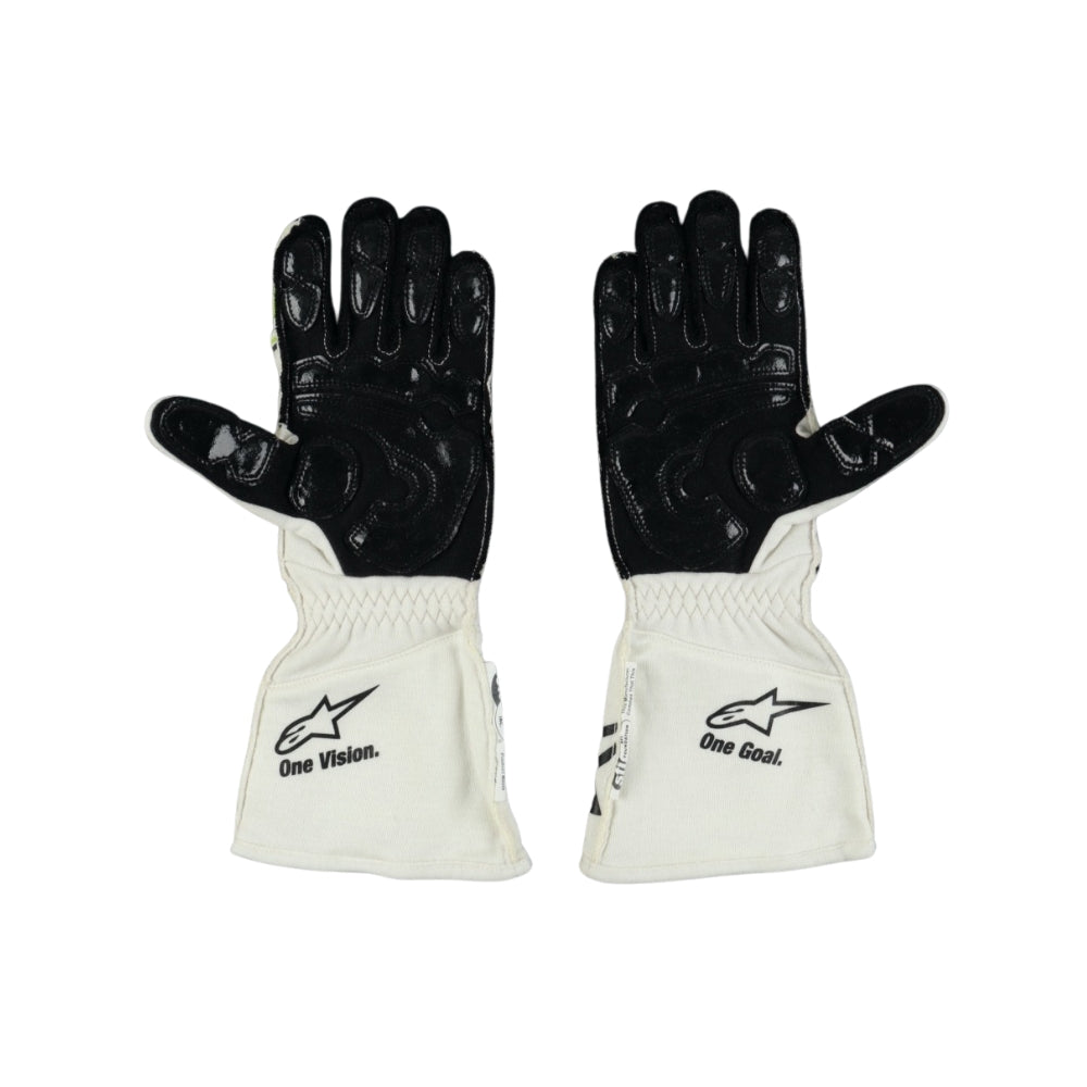 Pair of black and white Nyck de Vries 2022 F1 race gloves with visible branding on a white background