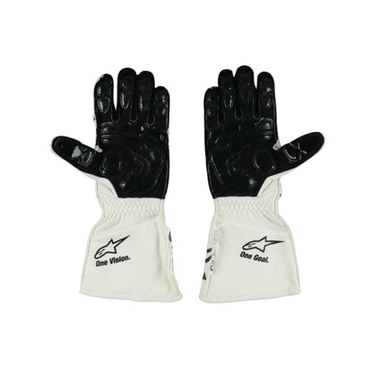 Pair of black and white Nyck de Vries 2022 F1 race gloves with visible branding on a white background