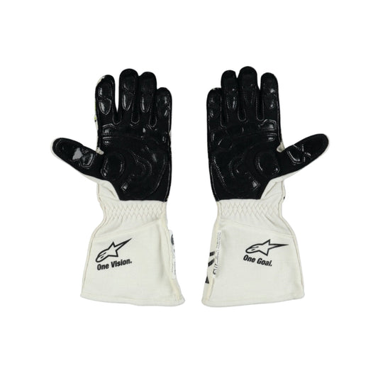 Pair of black and white Nyck de Vries 2022 F1 race gloves with visible branding on a white background