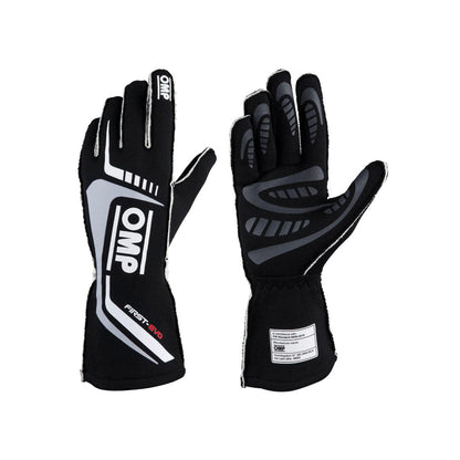 Pair of black and gray OMP First-EVO Race gloves with OMP branding on a white background