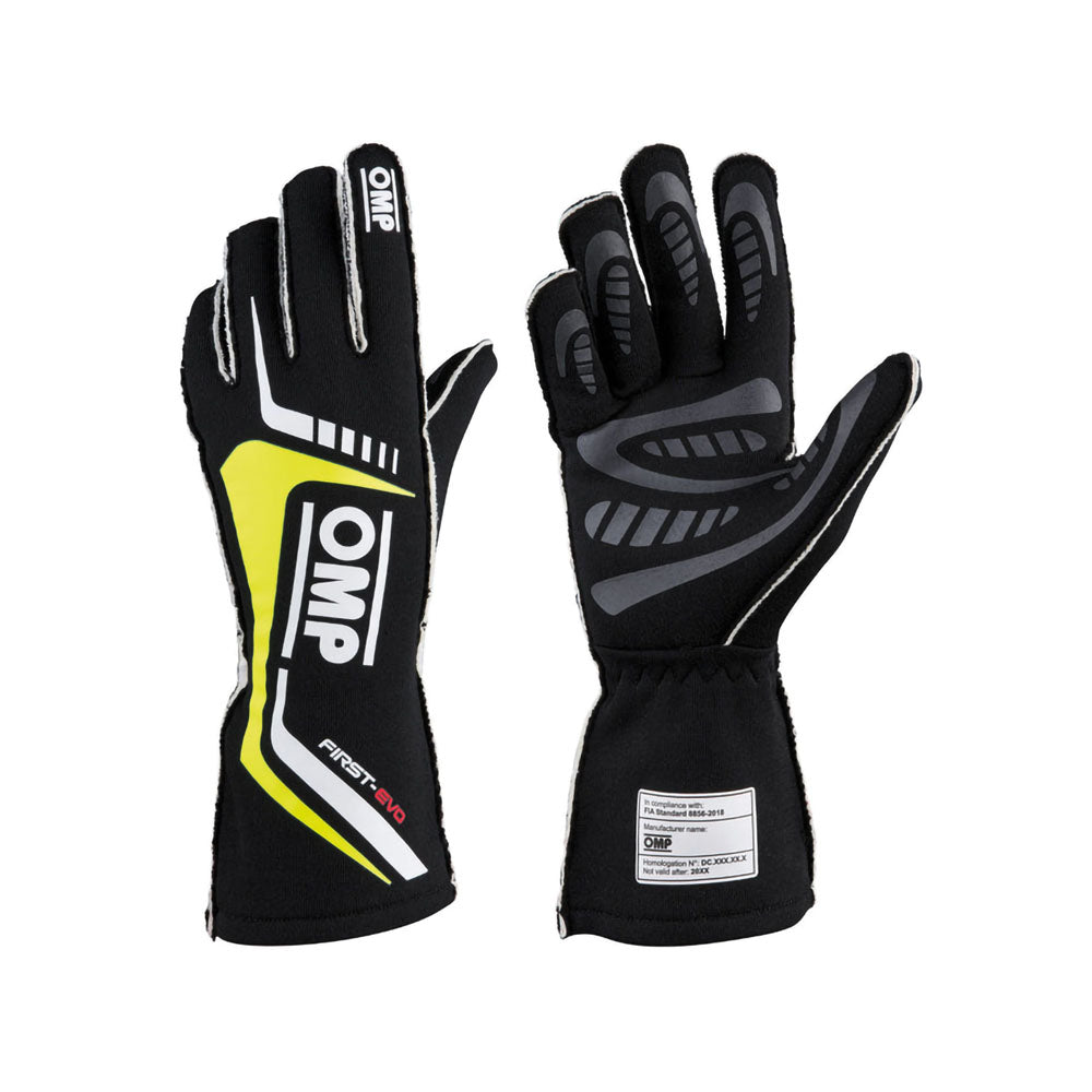 Black OMP First-EVO Race gloves with yellow and white accents on a white background