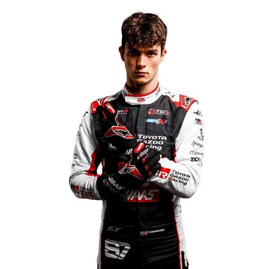 Oliver Bearman wearing a Haas racing suit with various sponsor logos with Close View