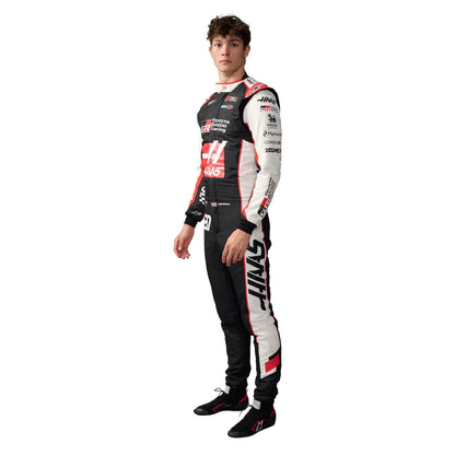 Oliver Bearman wearing a Haas racing suit with various sponsor logos with Left View