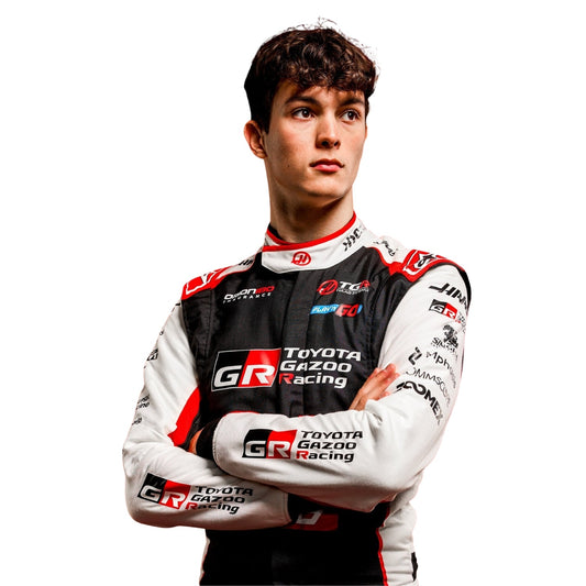 Oliver Bearman wearing a Haas racing suit with various sponsor logos with Close View