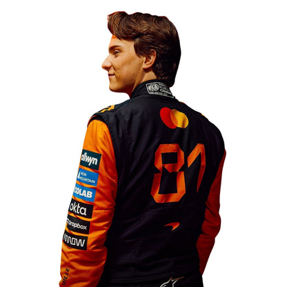 Oscar Piastri wearing a McLaren racing suit with various sponsor logos with Close View
