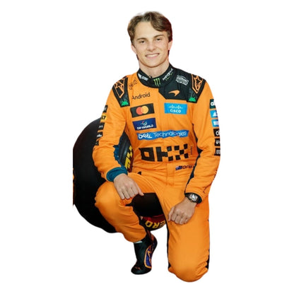 Oscar Piastri wearing a McLaren racing suit with various sponsor logos with Front View