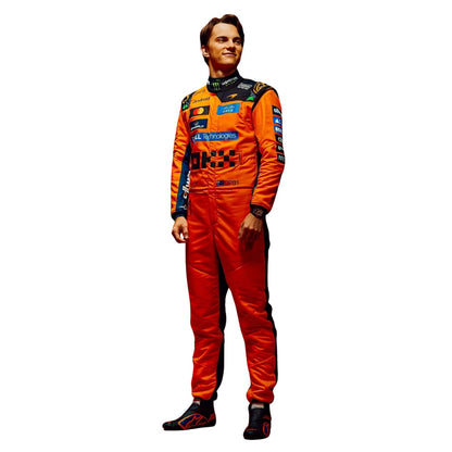 Oscar Piastri wearing a McLaren racing suit with various sponsor logos with Left View