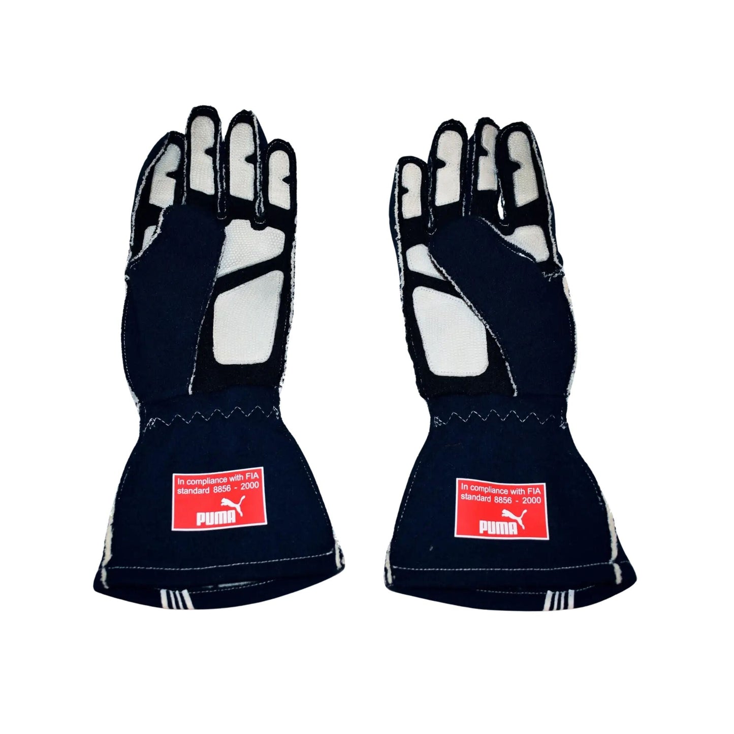 Pair of black Sebastian Vettel 2007/8 F1 race gloves with Puma logos on a white background