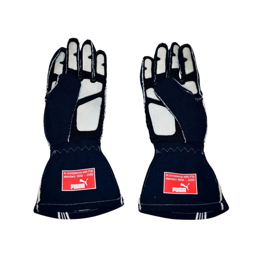 Pair of black Sebastian Vettel 2007/8 F1 race gloves with Puma logos on a white background