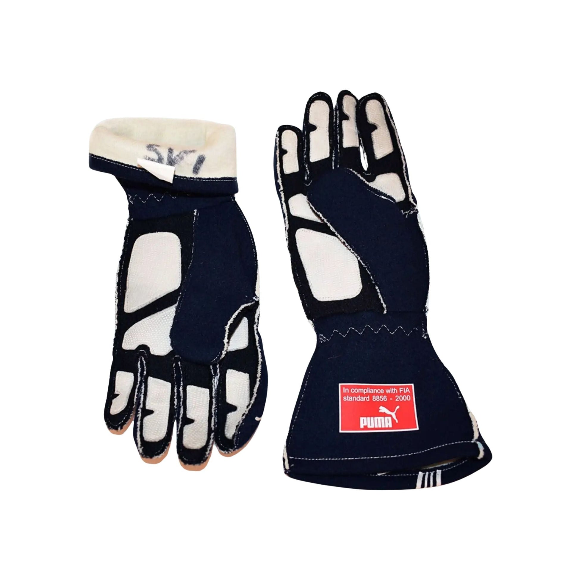 Pair of black and white Sebastian Vettel 2007/8 F1 race gloves with a Puma label on a white background