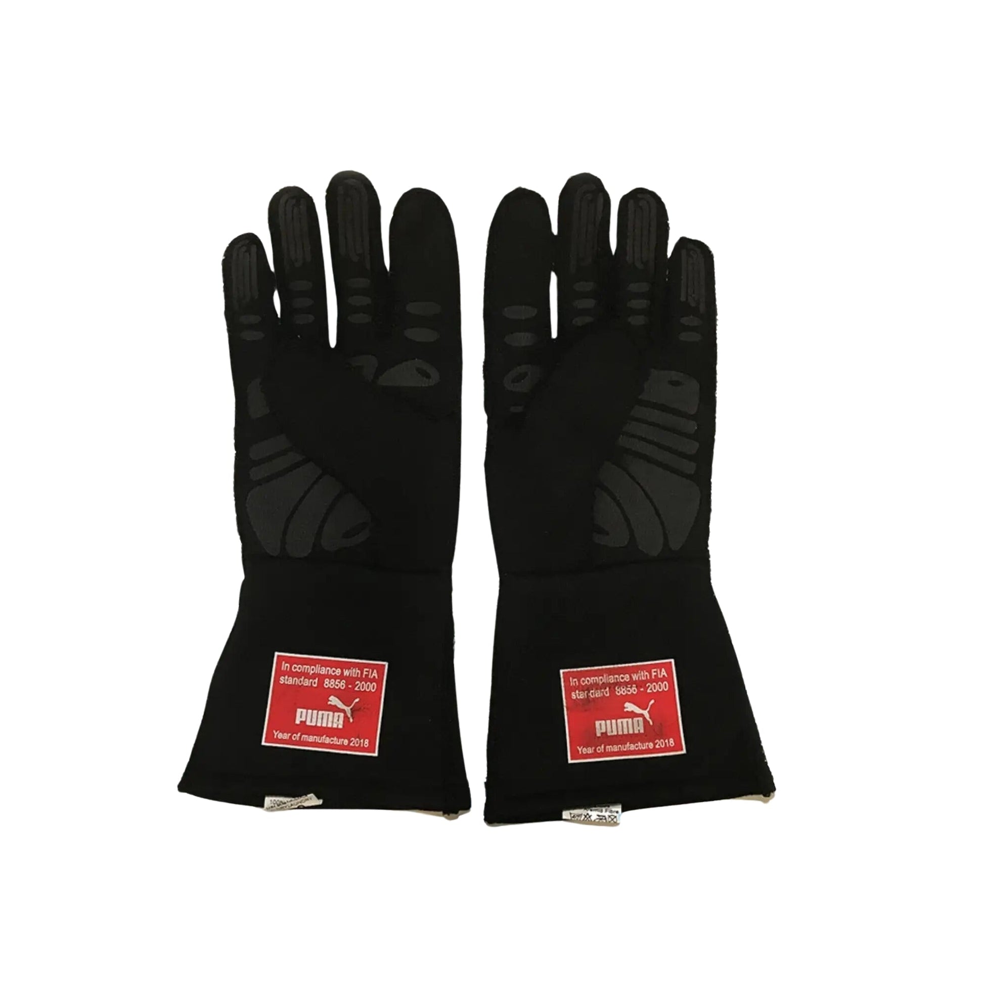 Pair of black Sebastian Vettel 2018 F1 race gloves with FIA compliance labels on a white background