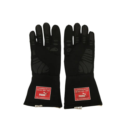 Pair of black Sebastian Vettel 2018 F1 race gloves with FIA compliance labels on a white background
