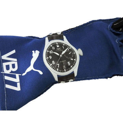 Valtteri Bottas 2018 F1 race gloves Wristwatch with black dial and silver case on a blue fabric background with 'VB17' branding.