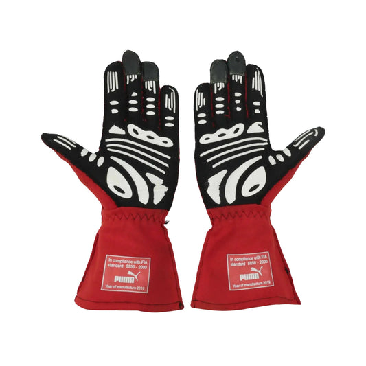 Pair of red and black Will Power 2020 IndyCar race gloves with Puma branding on a white background