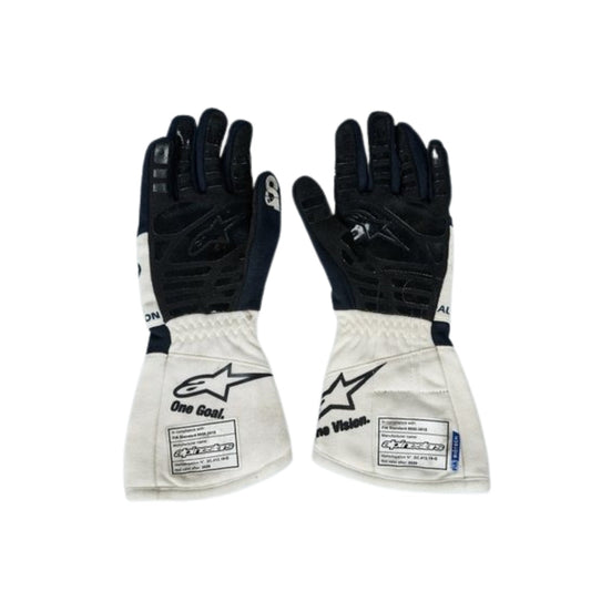 Pair of black and white Yuki Tsunoda 2022 F1 Race gloves on a white background