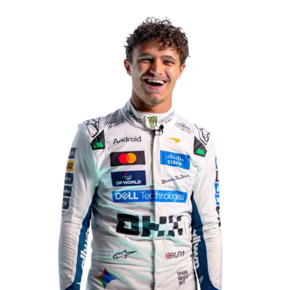 A smiling man wearing a white racing suit covered in sponsor logos, photographed against a plain white background.