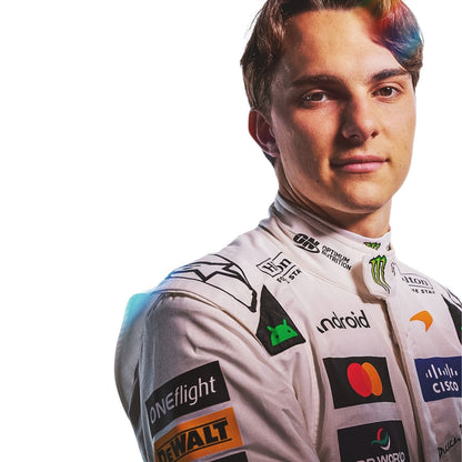 oscar piastri wearing a white racing suit with multiple sponsor logos against a plain white background.